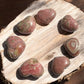 Rhodochrosite crystal heart with vibrant pink hues from Argentina