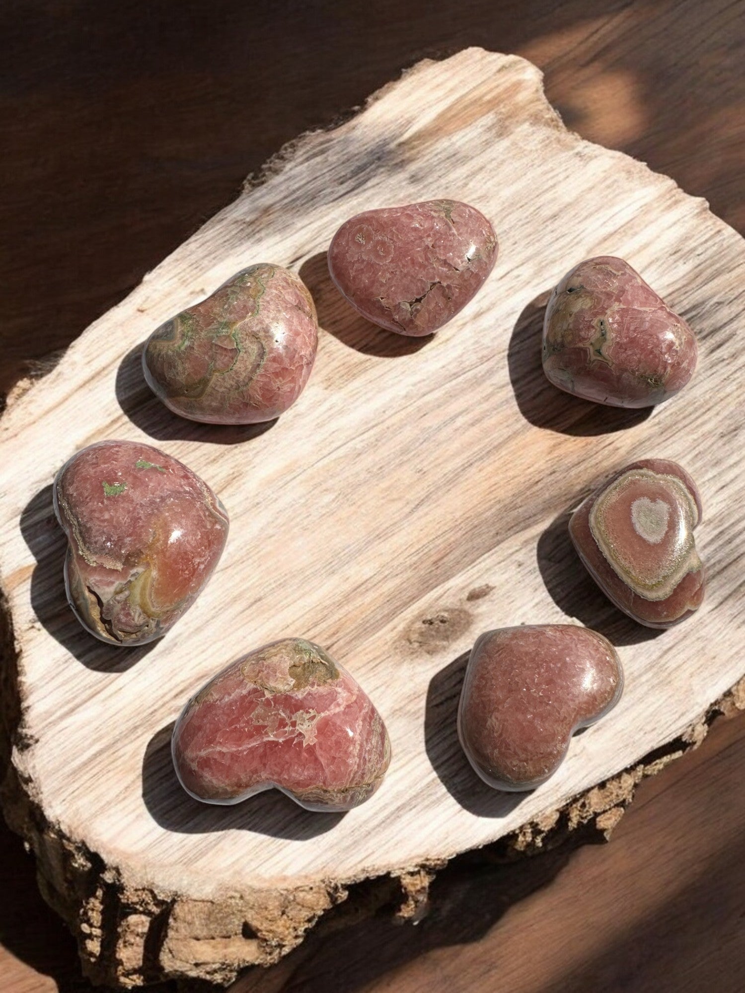 Rhodochrosite crystal heart with vibrant pink hues from Argentina