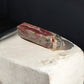 Rhodochrosite crystal point on the slab