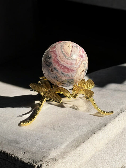 Rhodochrosite crystal sphere with soft pink tones from Argentina