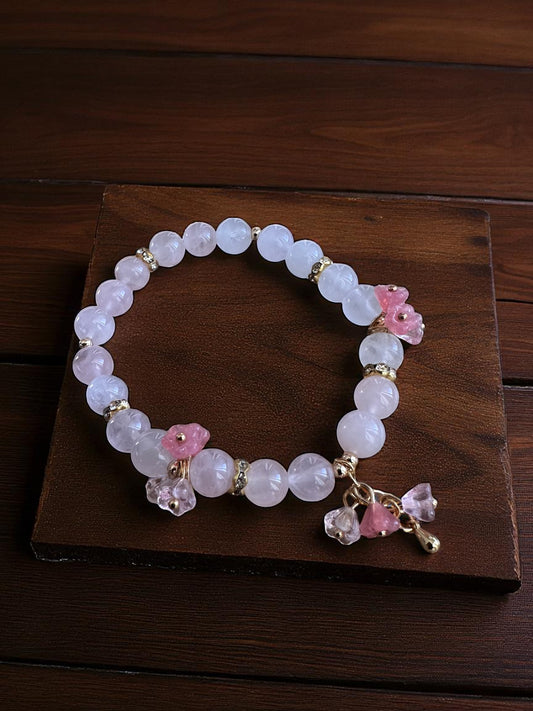 Rose quartz and glass flower bracelet with soft pink and clear tones