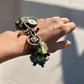 Side view of a handmade Moss Agate, Serpentine, and Green Aventurine Custom Watch