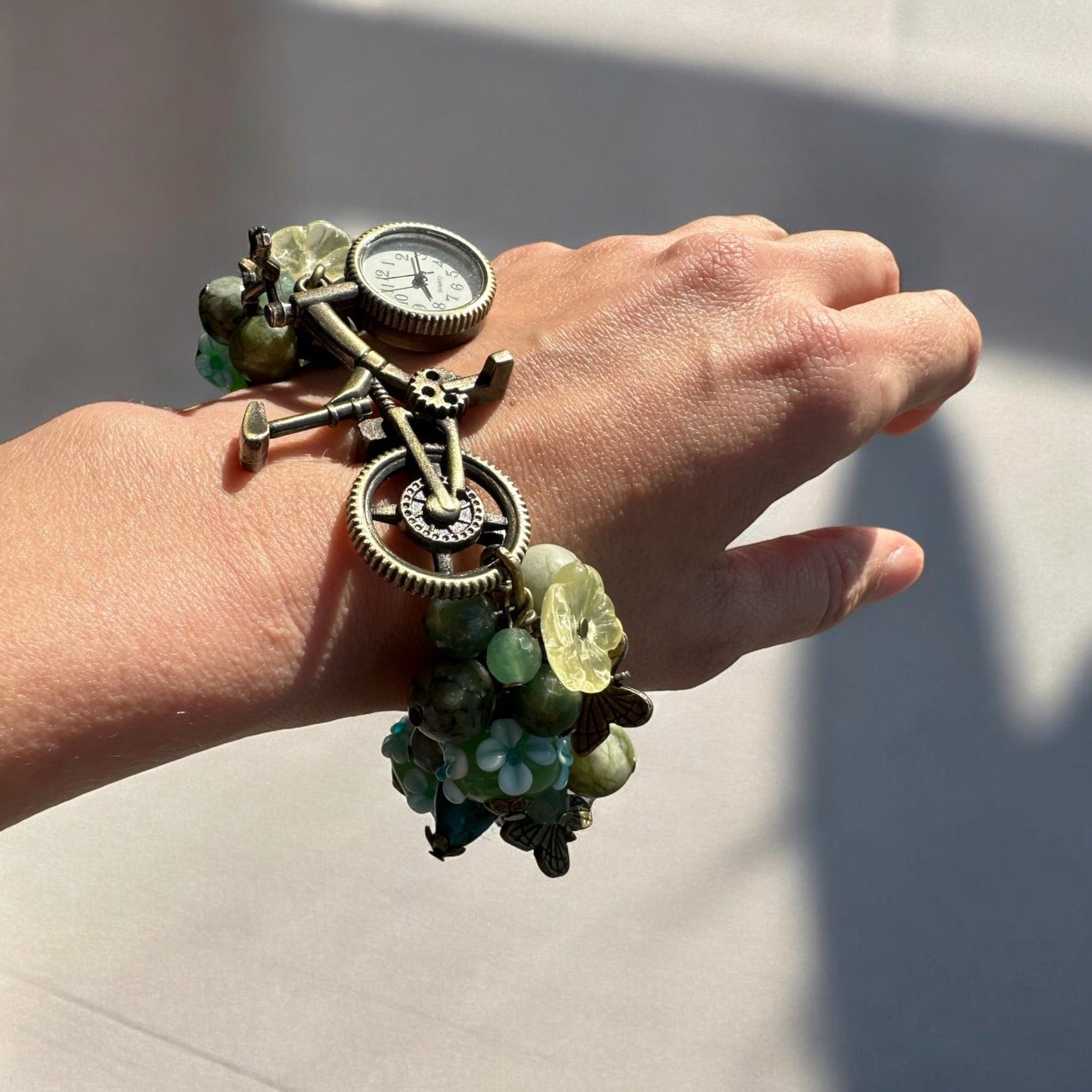 Side view of a handmade Moss Agate, Serpentine, and Green Aventurine Custom Watch