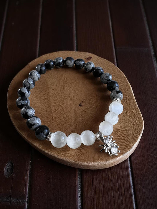 Snowflake obsidian and selenite bracelet with spider charm