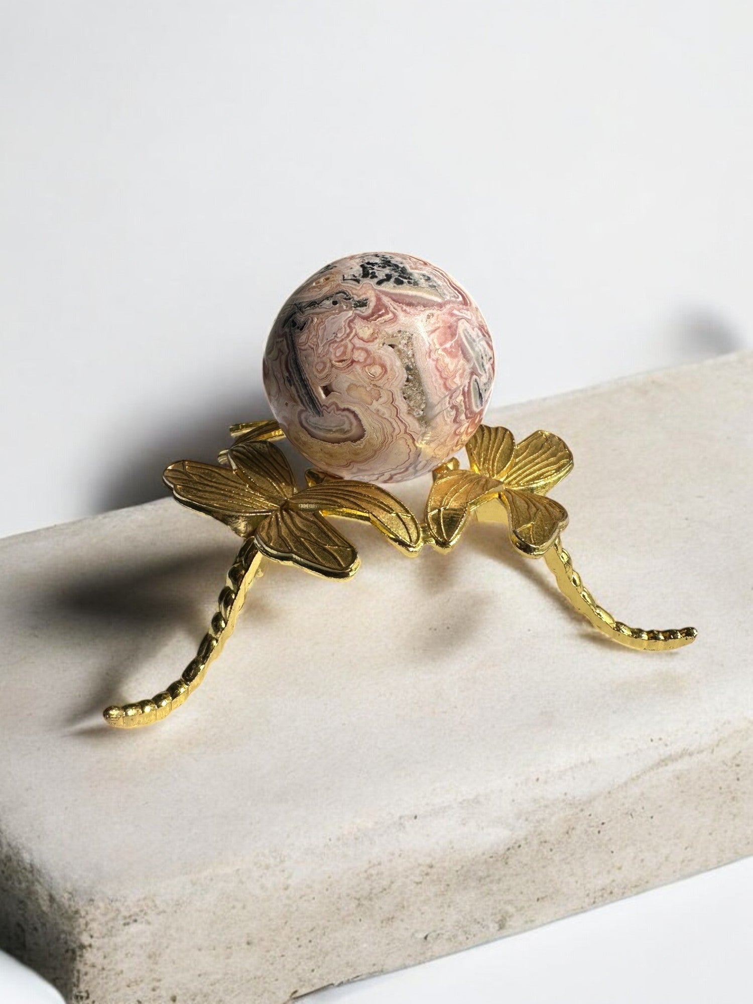 Stunning Rhodochrosite crystal ball with delicate patterns