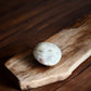 Sun stone in moonstone palm stone with brown veins