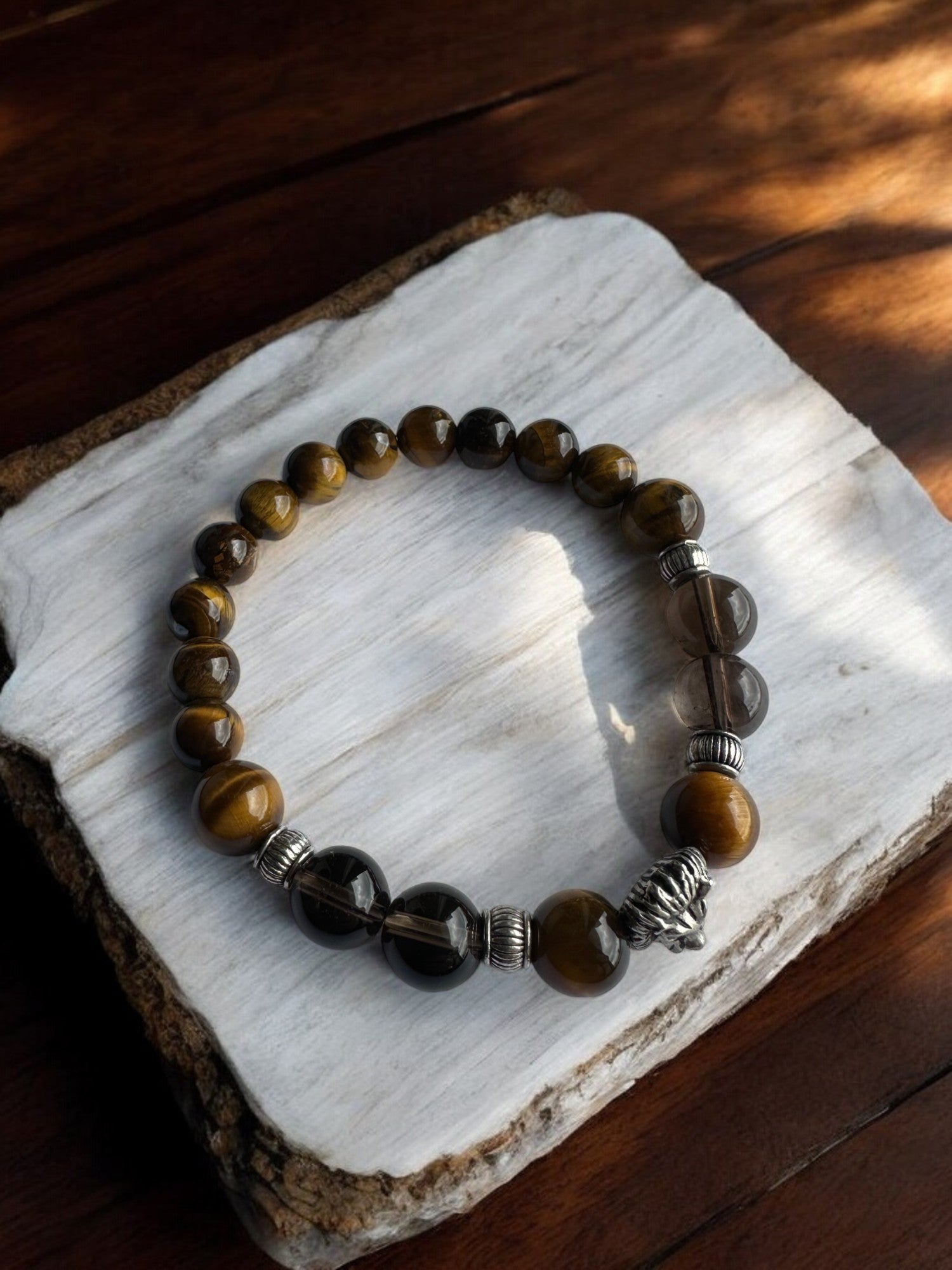 Top view of Tiger's Eye and Smoky Quartz Lion Crystal Bracelet