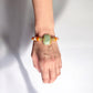 Wearing a Amazonite, Imperial Jasper, Agate, and Pearl Gemstone Bracelet