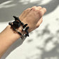 Wearing a Black Onyx, Black Tourmaline, Lava Stone, and Smoky Quartz Crystal gemstone set