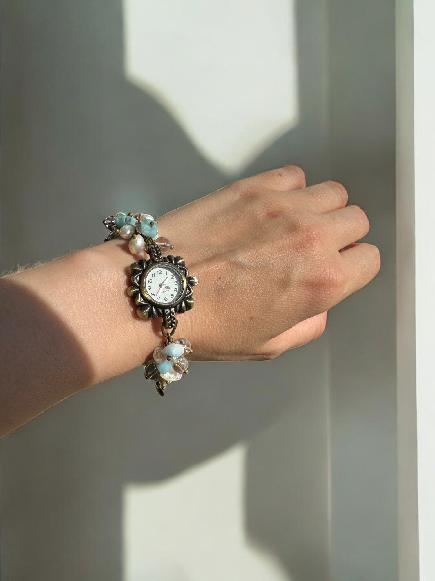 Wearing a Larimar, Pearl, and Clear Quartz Custom Watch