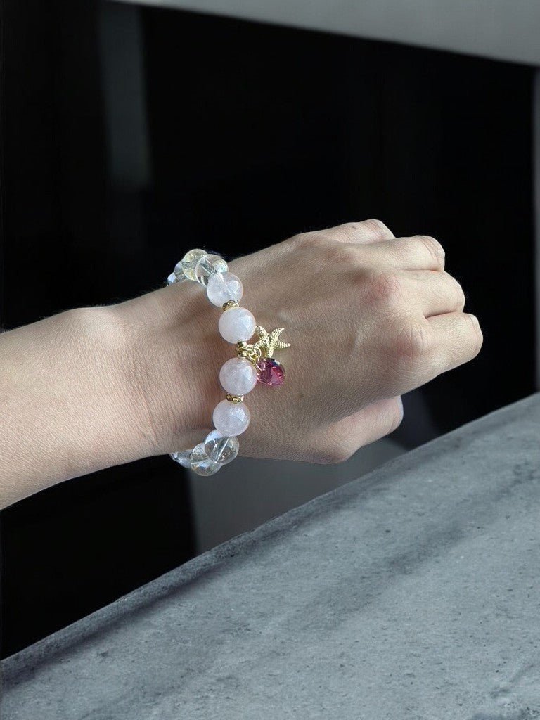 Wearing a Rose Quartz and Clear Quartz Swarovski Heart Crystal Bracelet