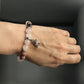 Wearing a Rose Quartz and Rhodonite Dog Crystal Bracelet