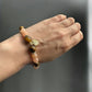 Wearing a Tiger's Eye and Pink Aventurine Life Tree Crystal Bracelet