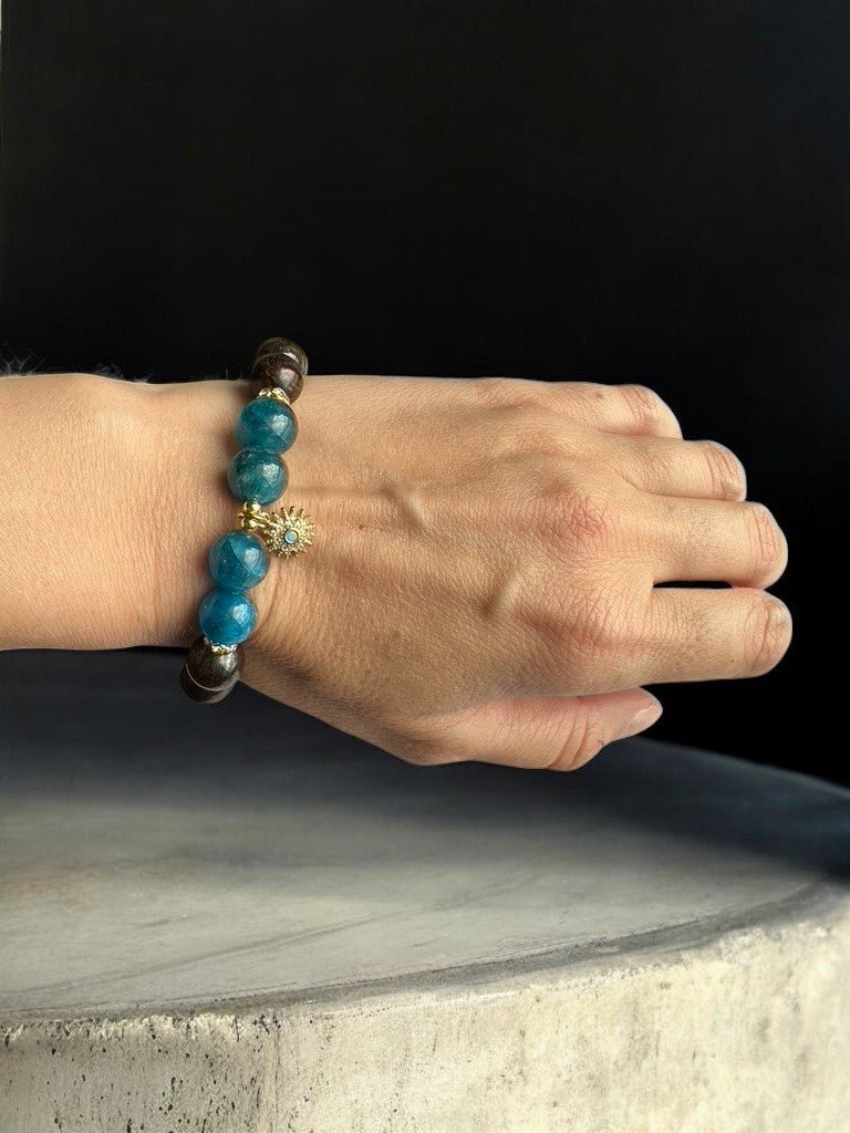 Wearing a blue apatite and bronzite sun crystal bracelet