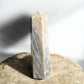 Black moonstone crystal tower with inclusions