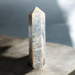 Black moonstone crystal tower on a slab