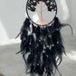 Black onyx crystal dreamcatcher in a room