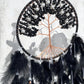 Black onyx crystal dreamcatcher on a wall