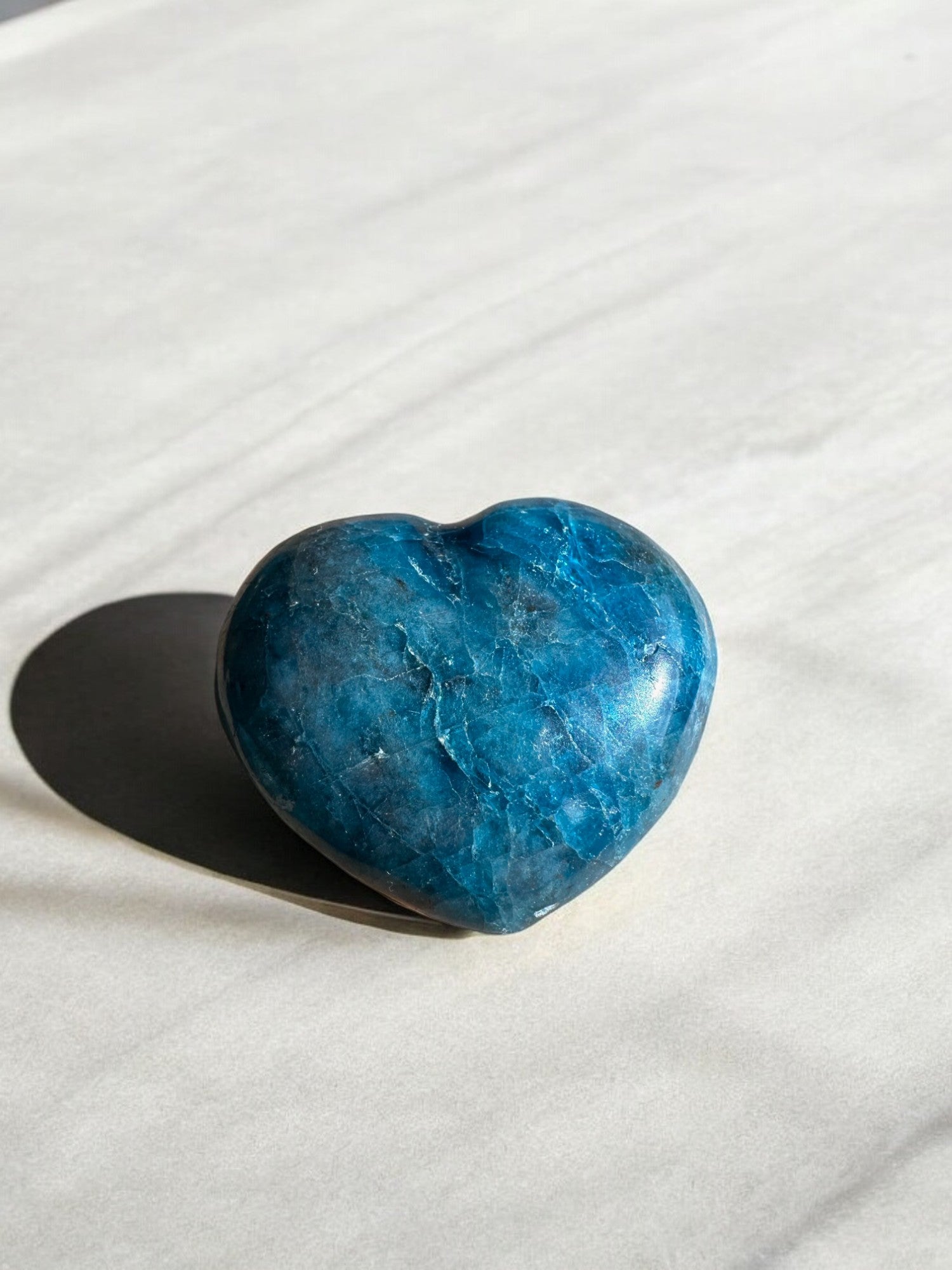 Blue apatite crystal heart with blue hues