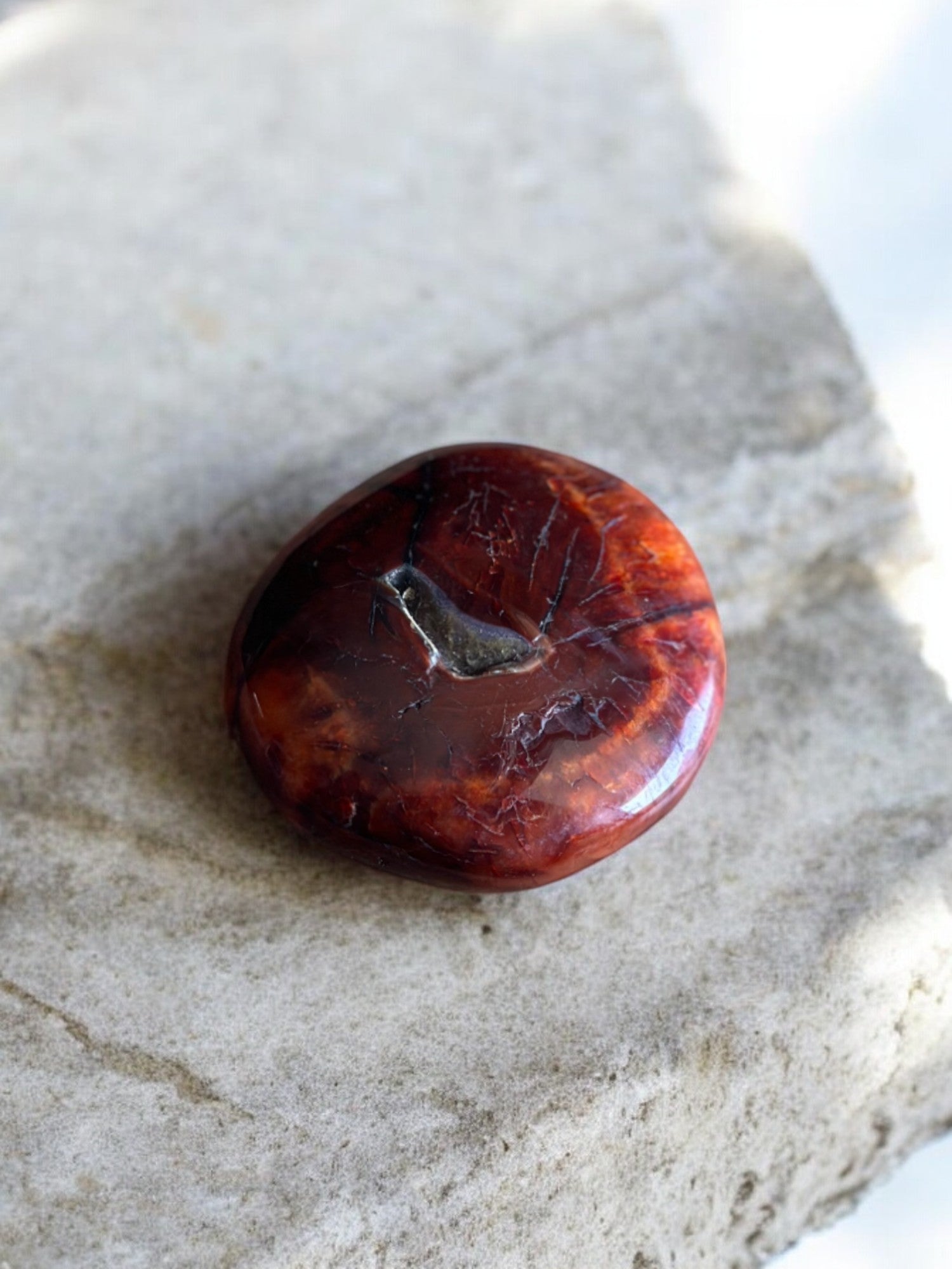 Carnelian palm stone on a slab