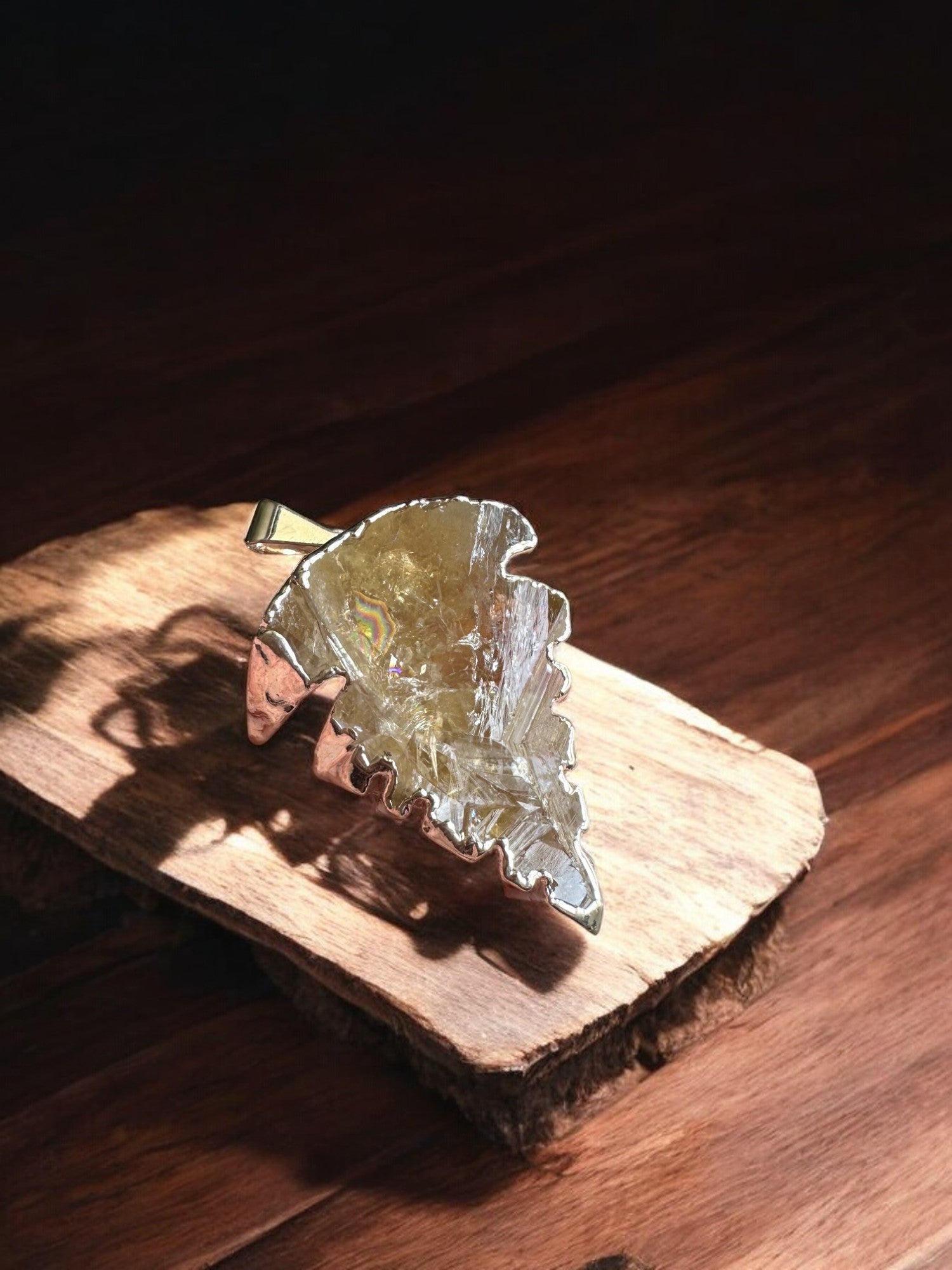 citrine crystal pendant option 4 on a wooden slab
