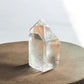 Clear quartz crystal tower with inclusions