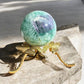 feather fluorite sphere variant 2 front view on a stand