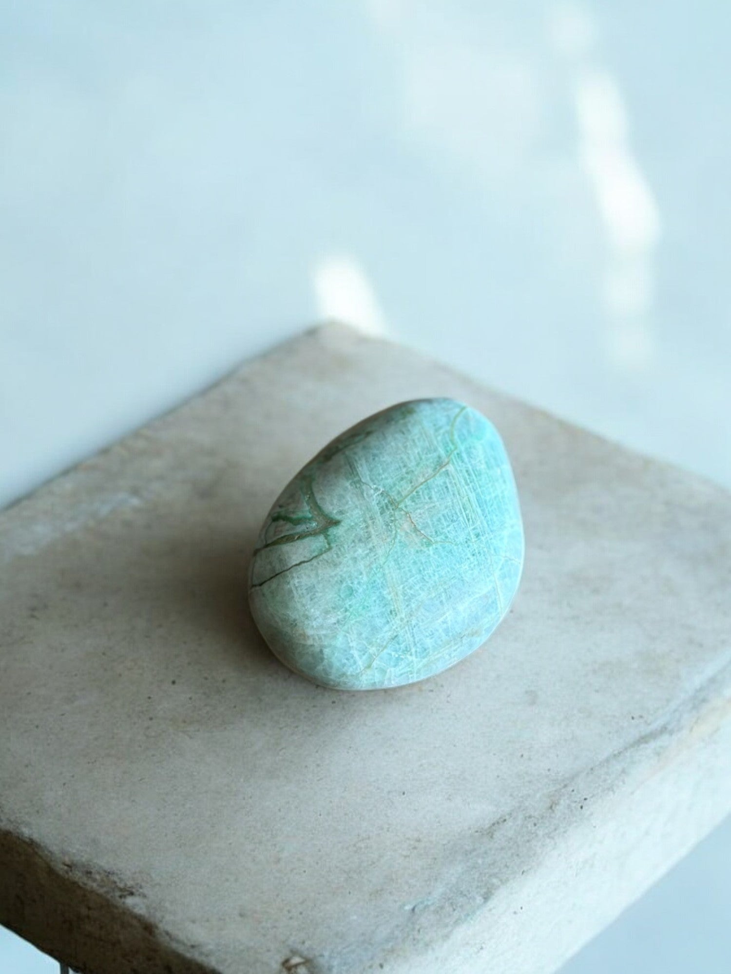 Green moonstone palm stone