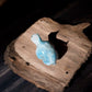 larimar stone tortoise crystal figurine on slab