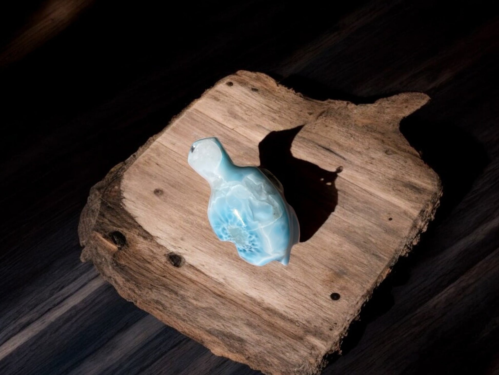 larimar stone tortoise crystal figurine on slab