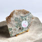 Ocean jasper crystal slab on a gold stand