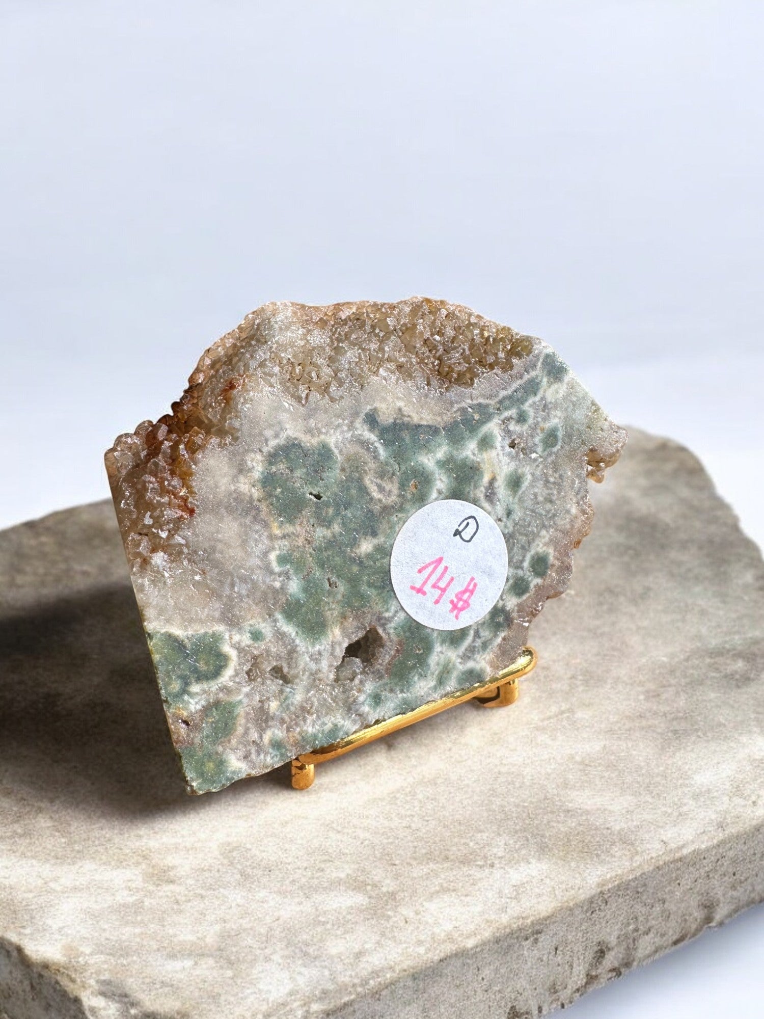 Ocean jasper crystal slab on a gold stand