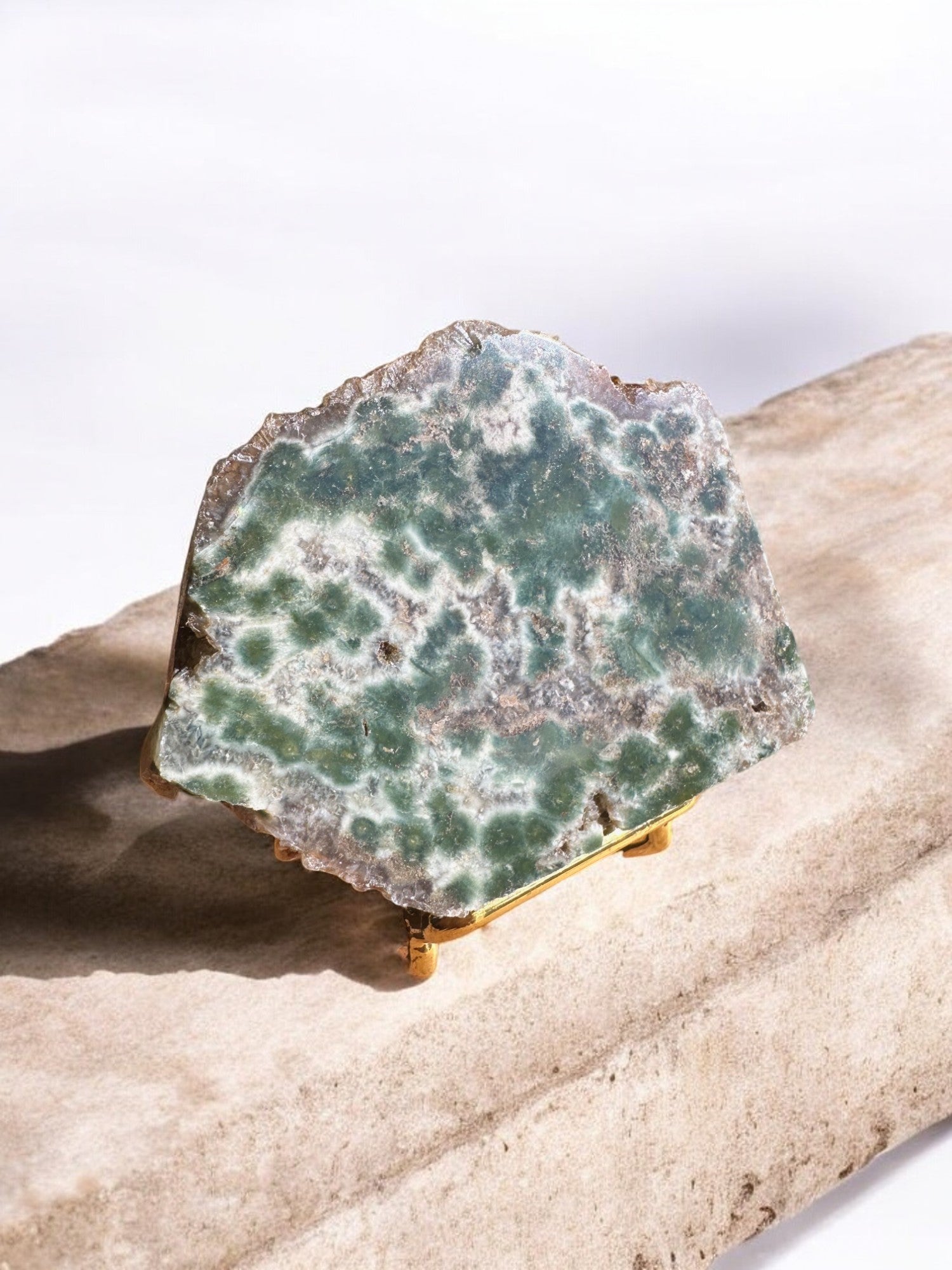 Ocean jasper crystal slab on a stand