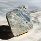 Ocean jasper crystal slab on a stand with green
