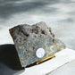 Ocean jasper crystal slab with different patterns on a stand