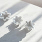 selenite snowflake crystal figurines on concrete
