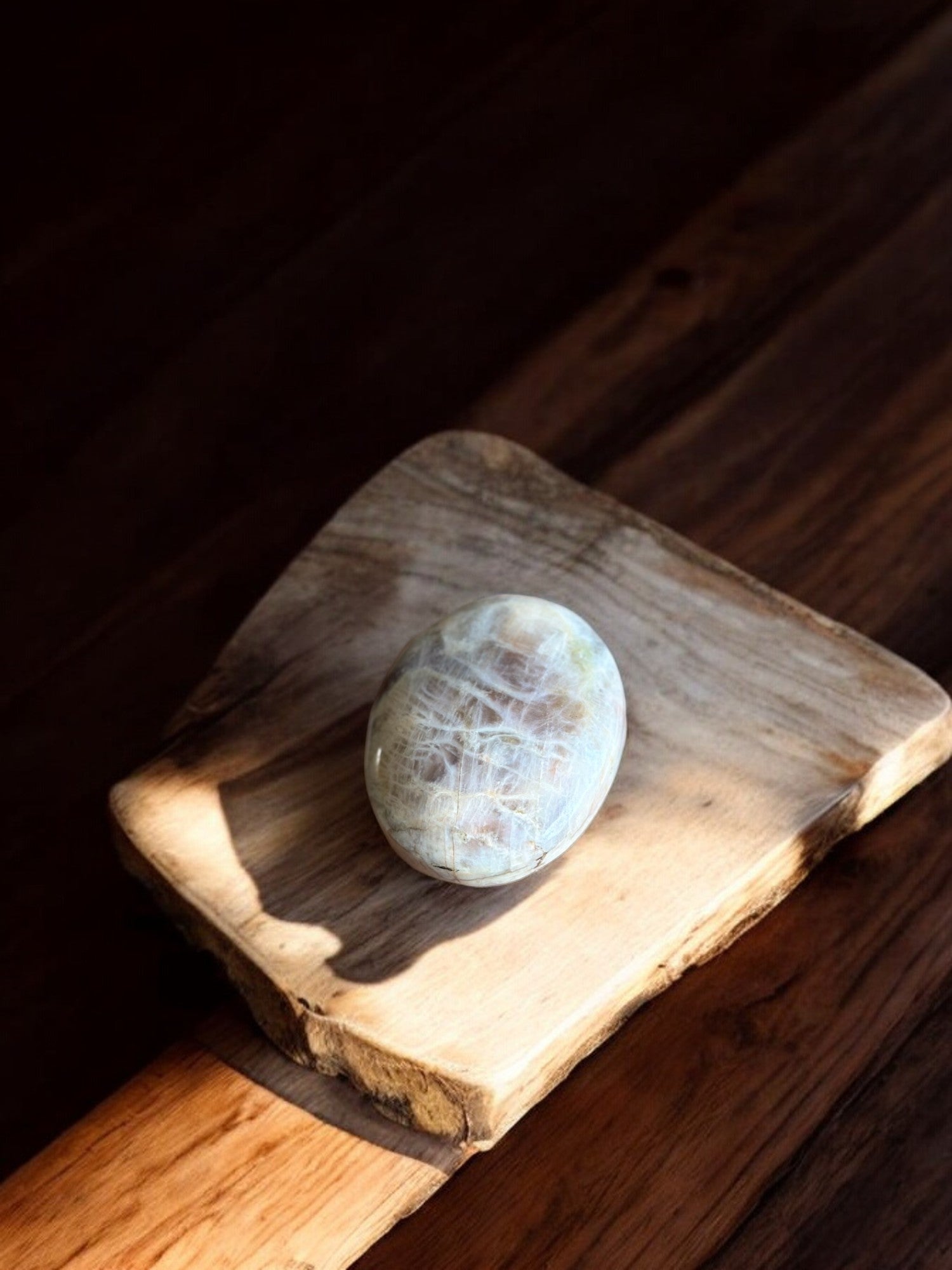 Sun stone in moonstone palm stone with gold flash