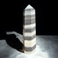 zebra calcite crystal tower on concrete option z12 front view