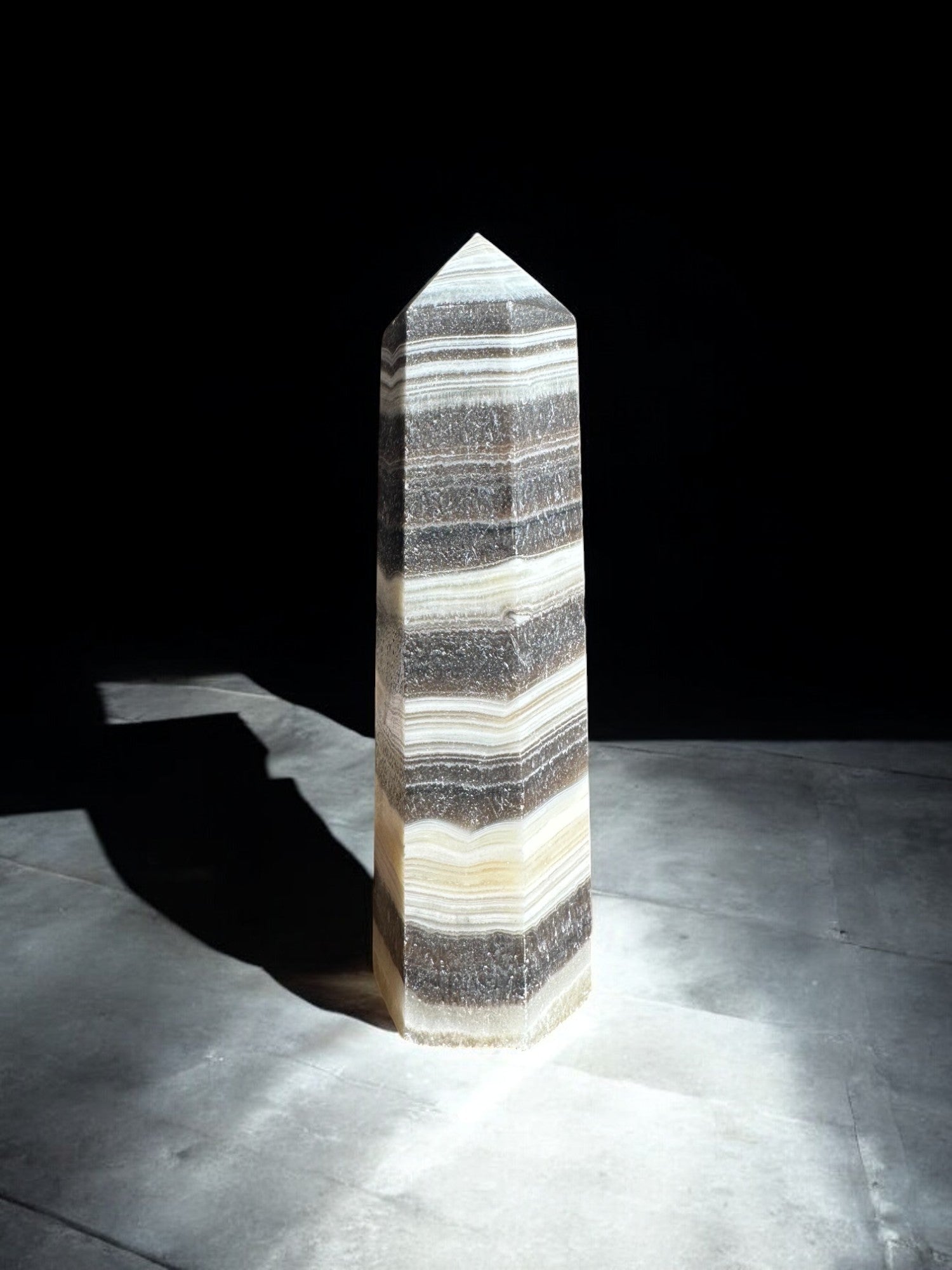 zebra calcite crystal tower on concrete option z12 front view