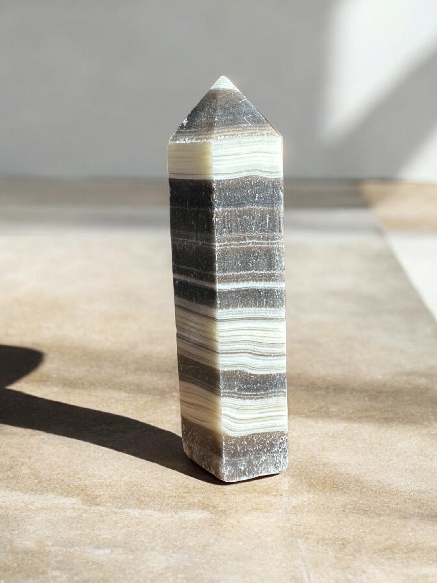 zebra calcite crystal tower on concrete option z14 back view
