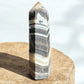 zebra calcite crystal tower on concrete option z15 back view