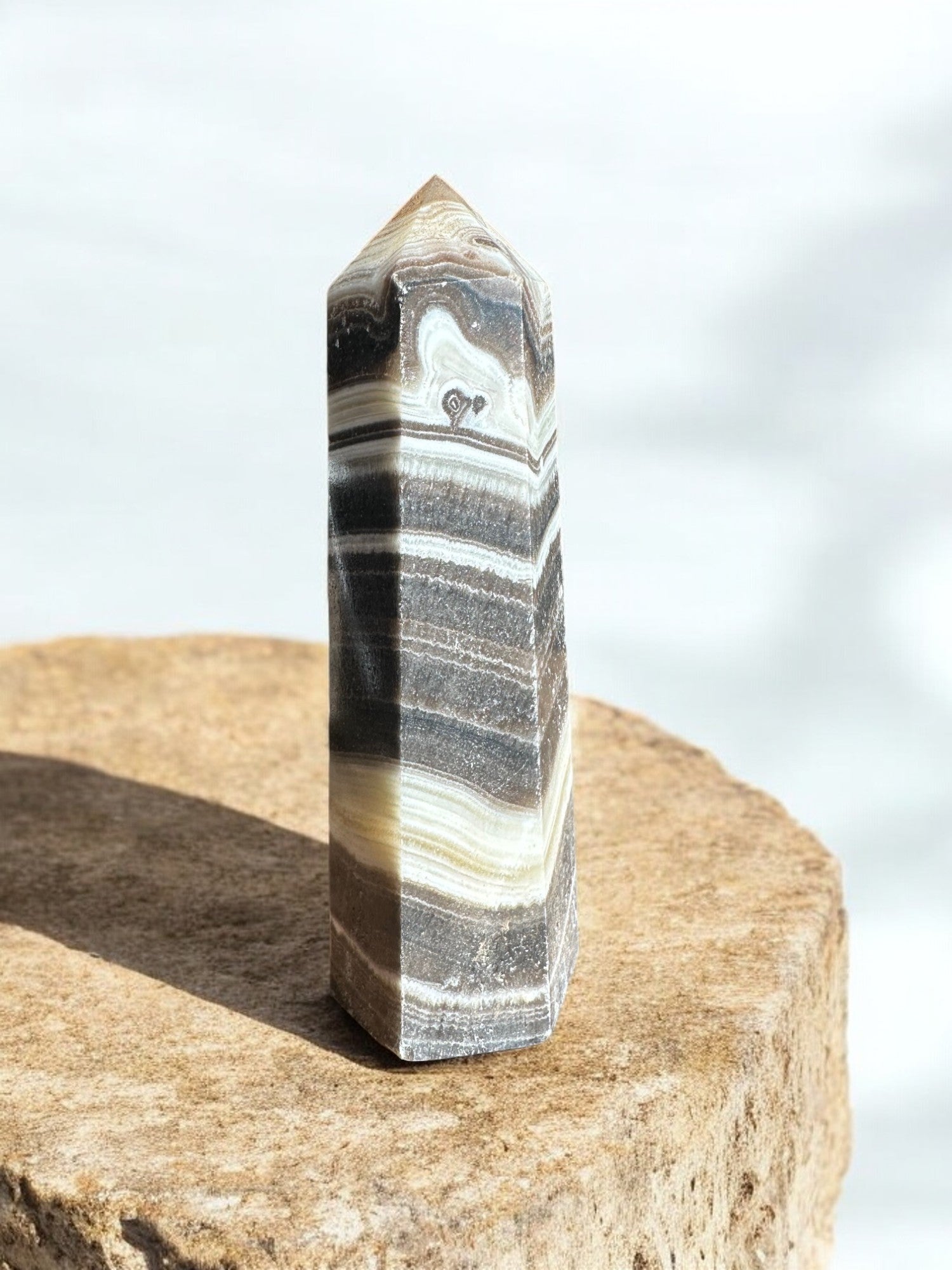 zebra calcite crystal tower on concrete option z15 back view