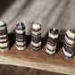 Zebra calcite crystal towers on wooden slab